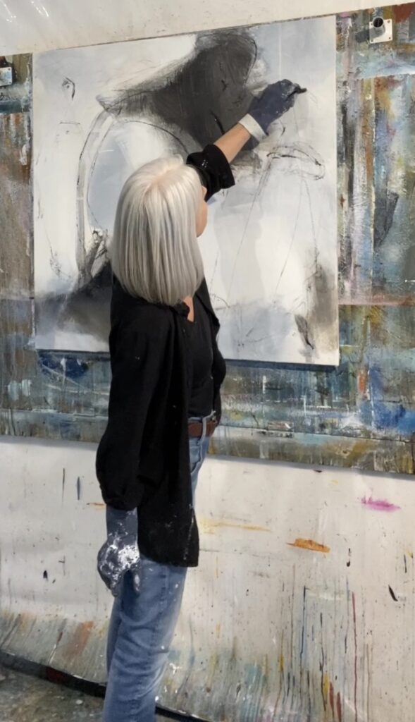 Anitta Jonas working on an original acrylic painting in her studio in Holte